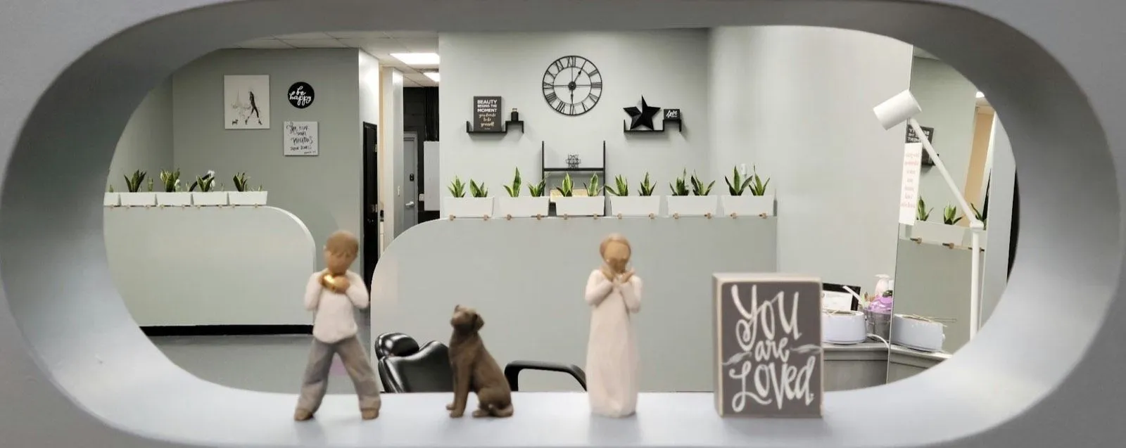 The salon floor at Beulah Beauty Boutique, styling stations along one wall